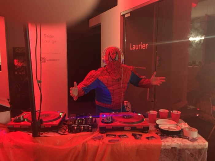 Don of Sound DJing in a Spider-Man costume at a corporate event